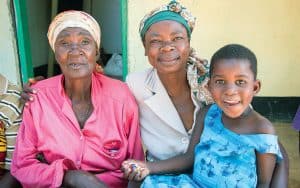 Grandmother, mother and daughter at the Bukumbi rehabilitation center, Tanzania