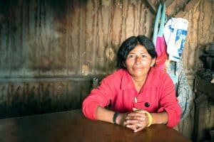 Peruvian woman sitting at table