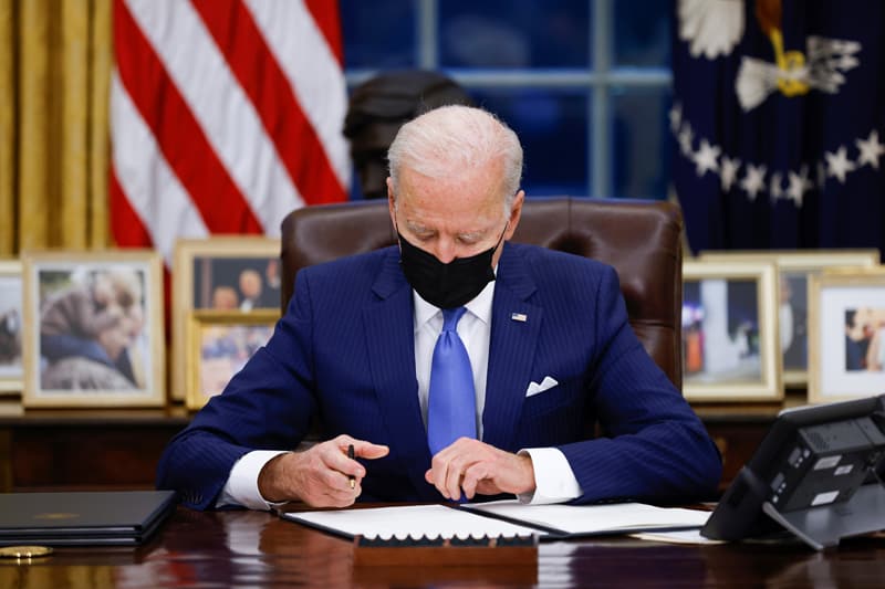 clinic Chicago meeting: President Joe Biden signs executive orders on immigration at the White House in Washington Feb. 2, 2021. (CNS photo/Tom Brenner, Reuters)