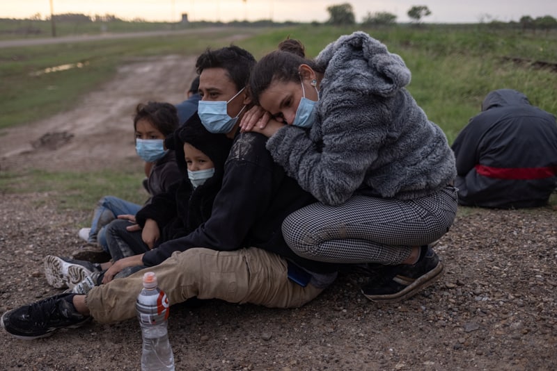 CLINIC statements: A migrant family from Nicaragua seeking asylum in the U.S. waits to be transported to a Border Patrol processing facility after crossing the Rio Grande into La Joya, Texas, May 13, 2021. (CNS photo/Adrees Latif, Reuters)