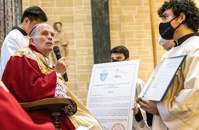 After World Mission Sunday Mass at St. Ferdinand Church, pastor Father Jason Torba and Cardinal Blase Cupich greet the congregation, including all those who do mission in Chicago. (Julie Jaidinger, Chicago Catholic/U.S.)