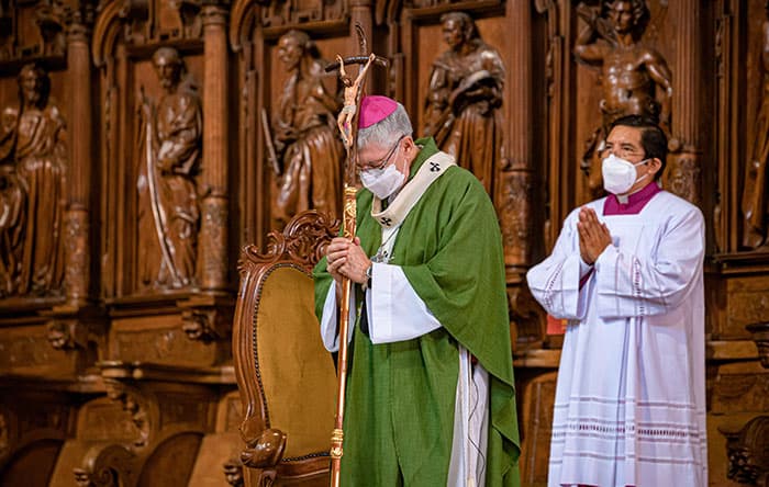 After World Mission Sunday Mass at St. Ferdinand Church, pastor Father Jason Torba and Cardinal Blase Cupich greet the congregation, including all those who do mission in Chicago. (Julie Jaidinger, Chicago Catholic/U.S.)