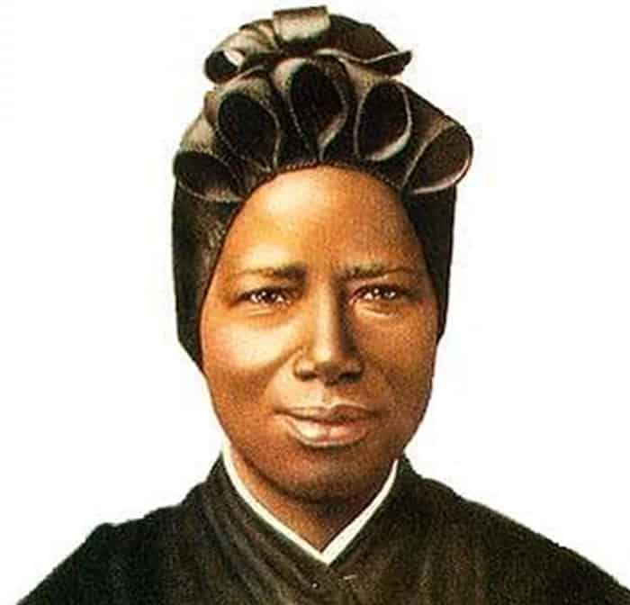 After World Mission Sunday Mass at St. Ferdinand Church, pastor Father Jason Torba and Cardinal Blase Cupich greet the congregation, including all those who do mission in Chicago. (Julie Jaidinger, Chicago Catholic/U.S.)