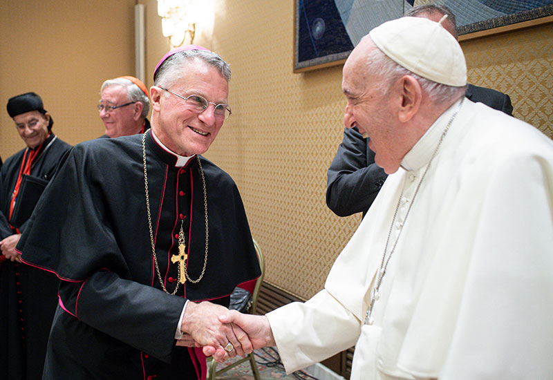 After World Mission Sunday Mass at St. Ferdinand Church, pastor Father Jason Torba and Cardinal Blase Cupich greet the congregation, including all those who do mission in Chicago. (Julie Jaidinger, Chicago Catholic/U.S.)